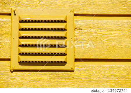 Outdoor ventilation grid in house wall 134272744
