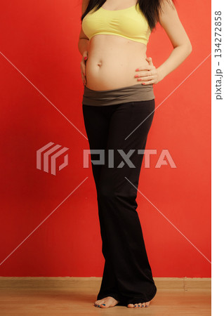 Closeup on tummy of pregnant woman 134272858