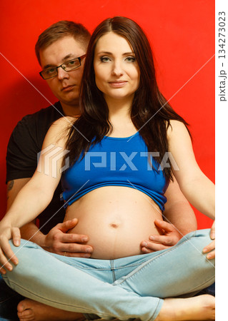 Pregnant woman and man relaxing together 134273023