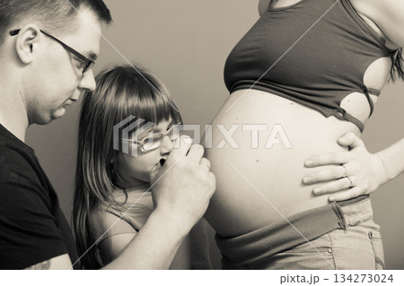 Pregnant woman belly, father drawing on stomach 134273024