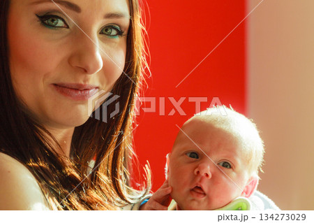 Mother holding her little newborn baby 134273029