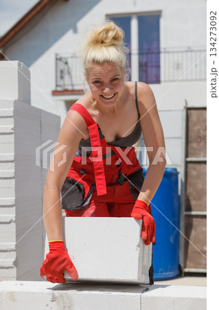 Woman working with airbricks Woman working with airbricks 134273092