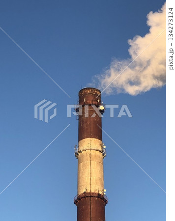 tall striped power plant chimney smokes tall striped power plant chimney smokes 134273124
