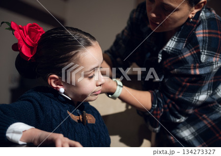 Tender Care Moment Between Child And Caregiver With Red Rose Accessory Tender Care Moment Between Child And Caregiver With Red Rose Accessory 134273327