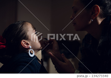 Mother Applies Makeup To Daughter In Soft Home Moment, Tender And Intimate Scene Mother Applies Makeup To Daughter In Soft Home Moment, Tender And Intimate Scene 134273340