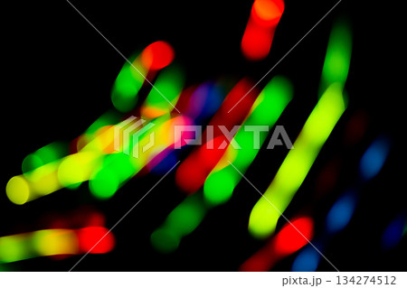 Fiber optic light effects and vibrant light trails. Trails of light swirling chaotically on background. 134274512