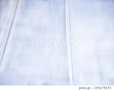 Open book with fictitious text high speed motion blurred background Open book with fictitious text high speed motion blurred background 134274573