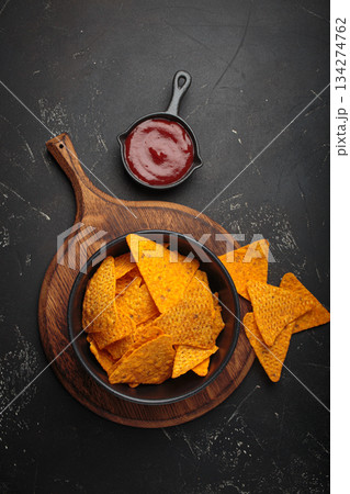Nachos tortilla chips salsa dip wooden board Mexican Tex-Mex snack fast food Nachos tortilla chips salsa dip wooden board Mexican Tex-Mex snack fast food 134274762