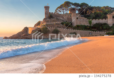 Medieval fortress and beach at sunrise, Tossa de Mar, Spain Medieval fortress and beach at sunrise, Tossa de Mar, Spain 134275278
