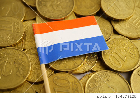 Nertherland flag on coins background, finance and accounting, banking concept. Nertherland flag on coins background, finance and accounting, banking concept. 134278129