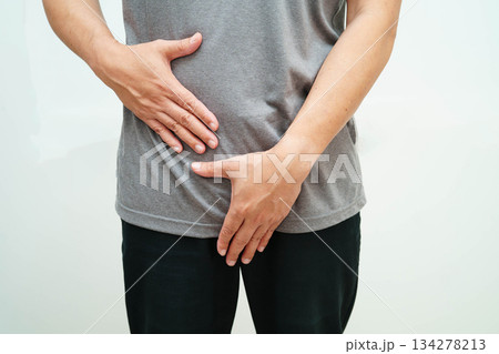 Hernia, Asian man stomach ache, abdominal pain and urology problem health. 134278213