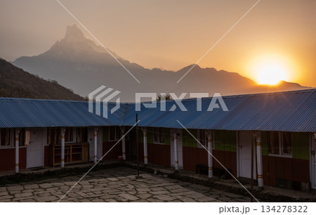 View of Machapuchare mountain (or Mt.Fish tail) seen from local village on the way to Mardi Himal high camp in Nepal. 134278322
