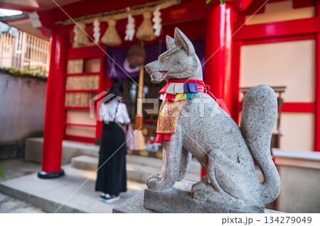 fox statue with Japanese woman sacred kushida shrine in Hakata, Fukuoka 134279049