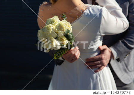 Beautiful part of white dress and flowers 134279778