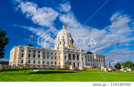 Minnesota State Capitol building stands in Saint Paul, USA. Renaissance Revival architecture features a white marble dome and golden quadriga statue under a blue sky Minnesota State Capitol building stands in Saint Paul, USA. Renaissance Revival architecture features a white marble dome and golden quadriga statue under a blue sky 134280500