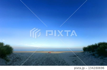 A Serene Beach Landscape featuring Beautiful Blue Skies and Gentle Ocean Waves at Peaceful Shores 134280696