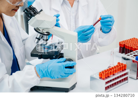 Doctor Talks With Professional Head Nurse or Surgeon, They Use Digital tablet Computer. Diverse Team of Health Care Specialists Discussing Test Doctor Talks With Professional Head Nurse or Surgeon, They Use Digital tablet Computer. Diverse Team of Health Care Specialists Discussing Test 134280710