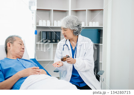 Medical doctor holing senior patient's hands and comforting her 134280715