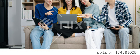 Group of young Asian college students working on his project assignment, using laptop computer and tablet an online informations. together, enjoy talking Group of young Asian college students working on his project assignment, using laptop computer and tablet an online informations. together, enjoy talking 134281029