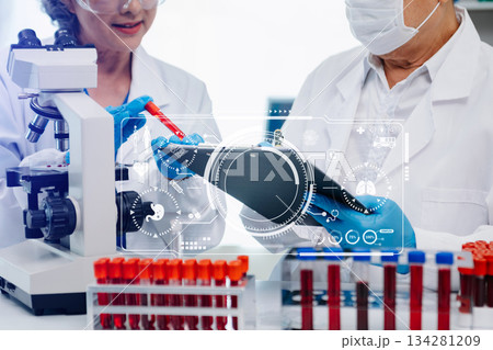 Scientist team meeting and writing analysis results in the laboratory study 134281209