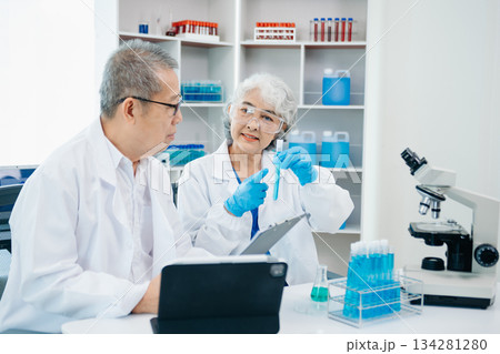 Scientist two woman with tablet and laptop, laboratory and ecofriendly science. Agriculture, research and scientists with online reading, test samples Scientist two woman with tablet and laptop, laboratory and ecofriendly science. Agriculture, research and scientists with online reading, test samples 134281280