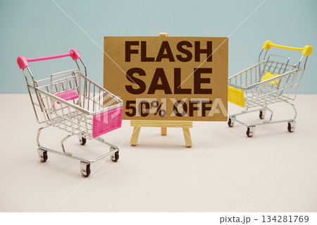 Flash Sale 50% off text with trolley shopping cart on pink background 134281769