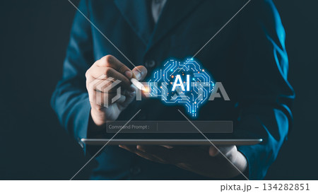 Businessman using digital pen on tablet with glowing AI brain icon, symbolizing artificial intelligence, innovation, big data, and future technology solutions. AI technology concept 134282851