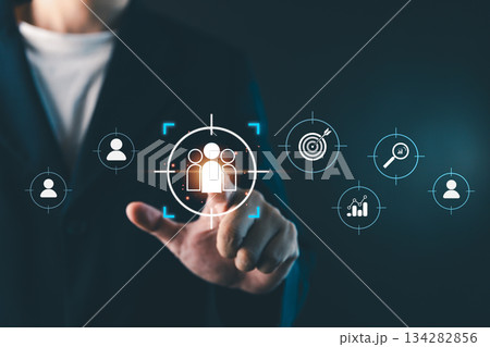 Businessman touching virtual target audience icon, digital marketing strategy concept showing customer segmentation, data analytics, and business targeting for online marketing success 134282856