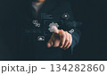 Businessman touching AI icon on virtual screen, symbolizing artificial intelligence, machine learning, digital technology, automation, innovation, and future data-driven business solutions. 134282860