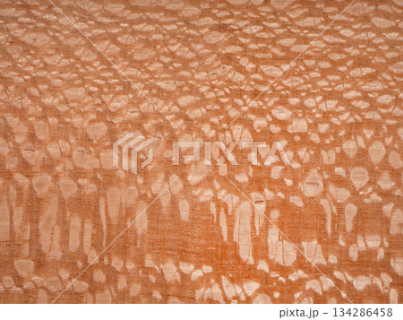 A close up of a piece of wooden surface with a nacre pattern on it A close up of a piece of wooden surface with a nacre pattern on it 134286458