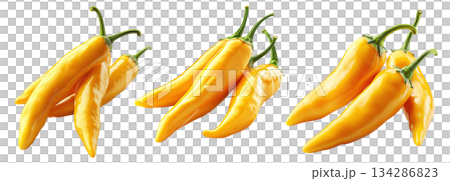 Yellow chili peppers with green stems isolated on a white transparent background. Spicy food and cooking ingredient concept 134286823