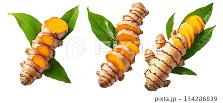 Turmeric root with sliced pieces and green leaves isolated on white transparent background. Concept of freshness and health benefits 134286839
