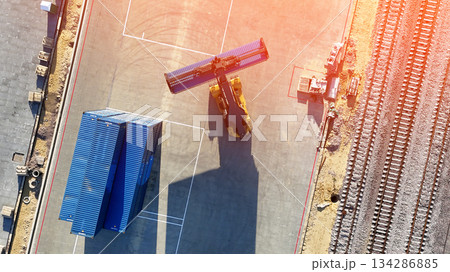 The Container Port Yard is a hub for the logistics industry. Forklifts are used to stack containers for import and export shipments. The Container Port Yard is a vital part of the logistics industry The Container Port Yard is a hub for the logistics industry. Forklifts are used to stack containers for import and export shipments. The Container Port Yard is a vital part of the logistics industry 134286885