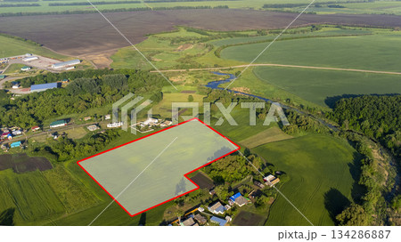 A piece of land, encompassing a view from above, a specific point on the ground, and a line that marks its boundaries. This land can be purchased, sold, developed, rented, or invested in. A piece of land, encompassing a view from above, a specific point on the ground, and a line that marks its boundaries. This land can be purchased, sold, developed, rented, or invested in. 134286887