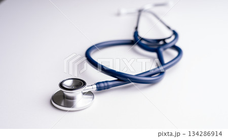 Stethoscope medical tool. A medical instrument is a stethoscope on a white background, shooting at an acute angle. Therapist's tool for patient diagnosis Stethoscope medical tool. A medical instrument is a stethoscope on a white background, shooting at an acute angle. Therapist's tool for patient diagnosis 134286914