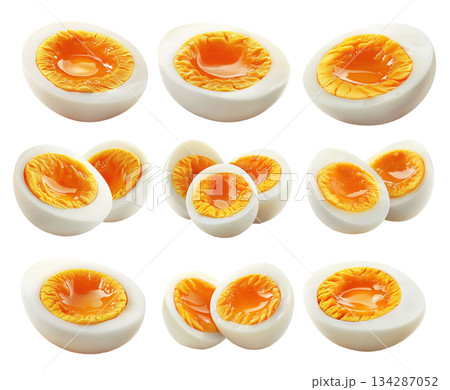 Whole and sliced hard-boiled eggs with firm yolk isolated on white transparent background 134287052