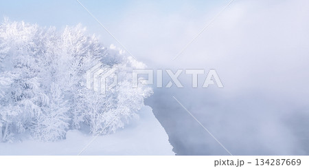 Siberian winter scene with snow-covered trees and a river in Krasnoyarsk during the New Year and Christmas season. High quality photo Siberian winter scene with snow-covered trees and a river in Krasnoyarsk during the New Year and Christmas season. High quality photo 134287669