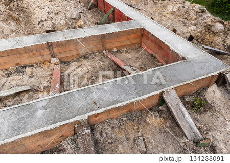 Rugged building site showcasing a concrete foundation formwork set 134288091
