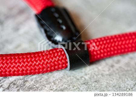 Red braided rope, black detail Red braided rope, black detail 134289186