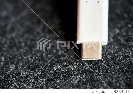 USB connector on dark surface 134289198