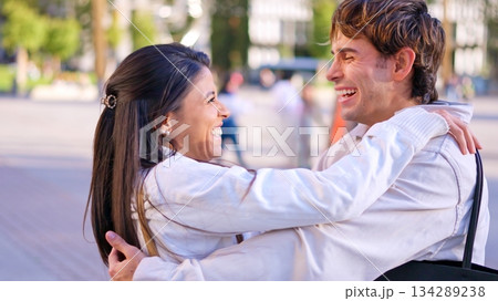 Happy diverse couple embracing outdoors enjoying inclusion 134289238