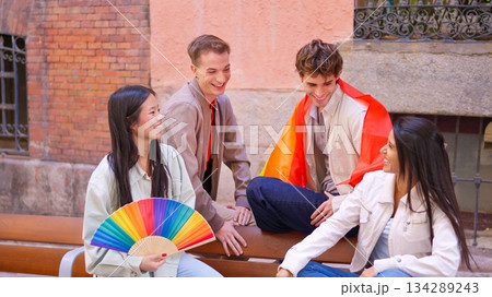 Young diverse friends celebrating pride and inclusion smiling outdoors 134289243