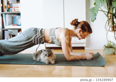 Yoga with pet cat 134289907