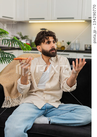 Indian man angry on smartphone loudspeaker arguing with bank operator about spam call and scam fraud Indian man angry on smartphone loudspeaker arguing with bank operator about spam call and scam fraud 134290770