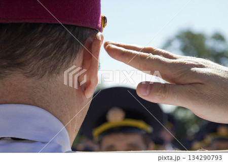 Officer salutes the troops 134290793