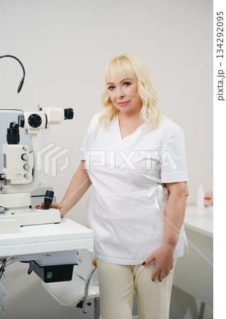 Ophthalmologist in clinic with eye examination equipment 134292095