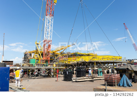 Offshore platform under construction with crane. 134292262