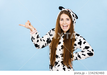 Woman wearing pajamas cartoon pointing Woman wearing pajamas cartoon pointing 134292460