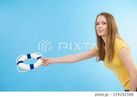 Girl holds life buoy rescue ring Girl holds life buoy rescue ring 134292566