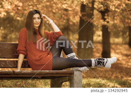 Beauty girl in autumnal time relax outdoors. Beauty girl in autumnal time relax outdoors. 134292945